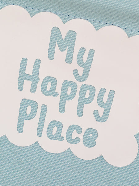 A close-up of a blue canvas banner that reads My Happy Place in a white scalloped box.