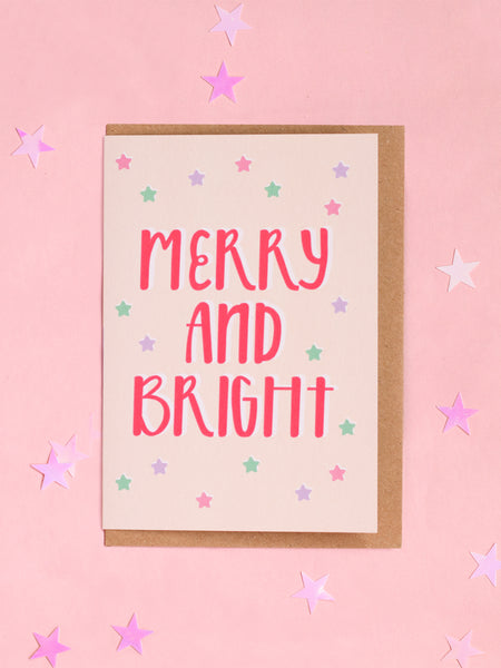 A Christmas card with 'merry and bright' written in modern typography.