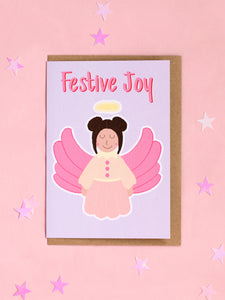 A Christmas card with a pastel dressed angel on the front with the text 'Festive Joy' at the top.