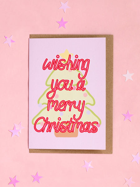 A Christmas card with 'wishing you a merry christmas' in front of a pastel Christmas tree.