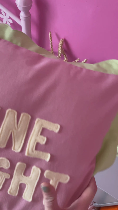 A pink cushion with green scalloped trim and 'Shine Bright' lettering on the front is opened by the concealed zip and shows close-ups of fabric details.