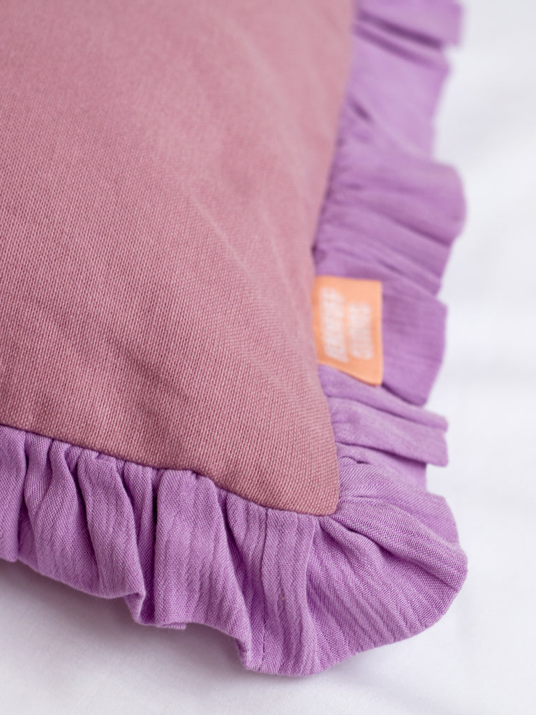 A close-up of a purple ruffle cushion cover to show the ruffles and textured details.