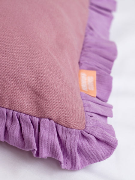 A close-up of a purple ruffle cushion cover to show the ruffles and textured details.